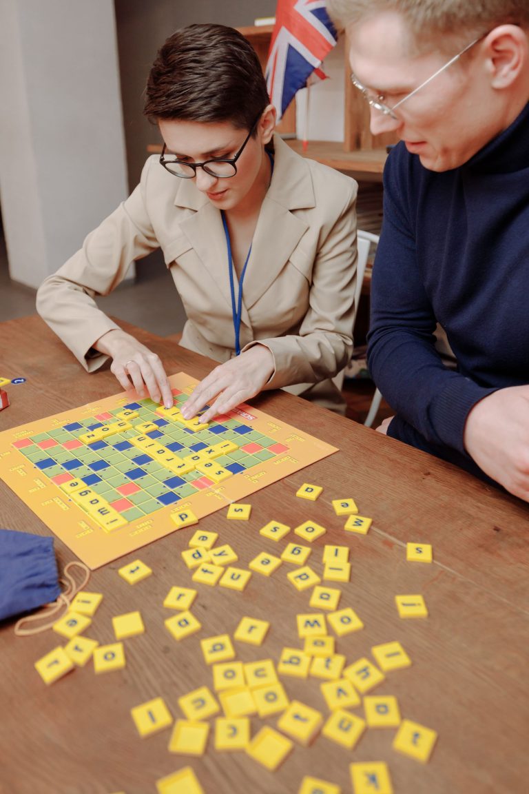 Woman playing a word game with letter tiles