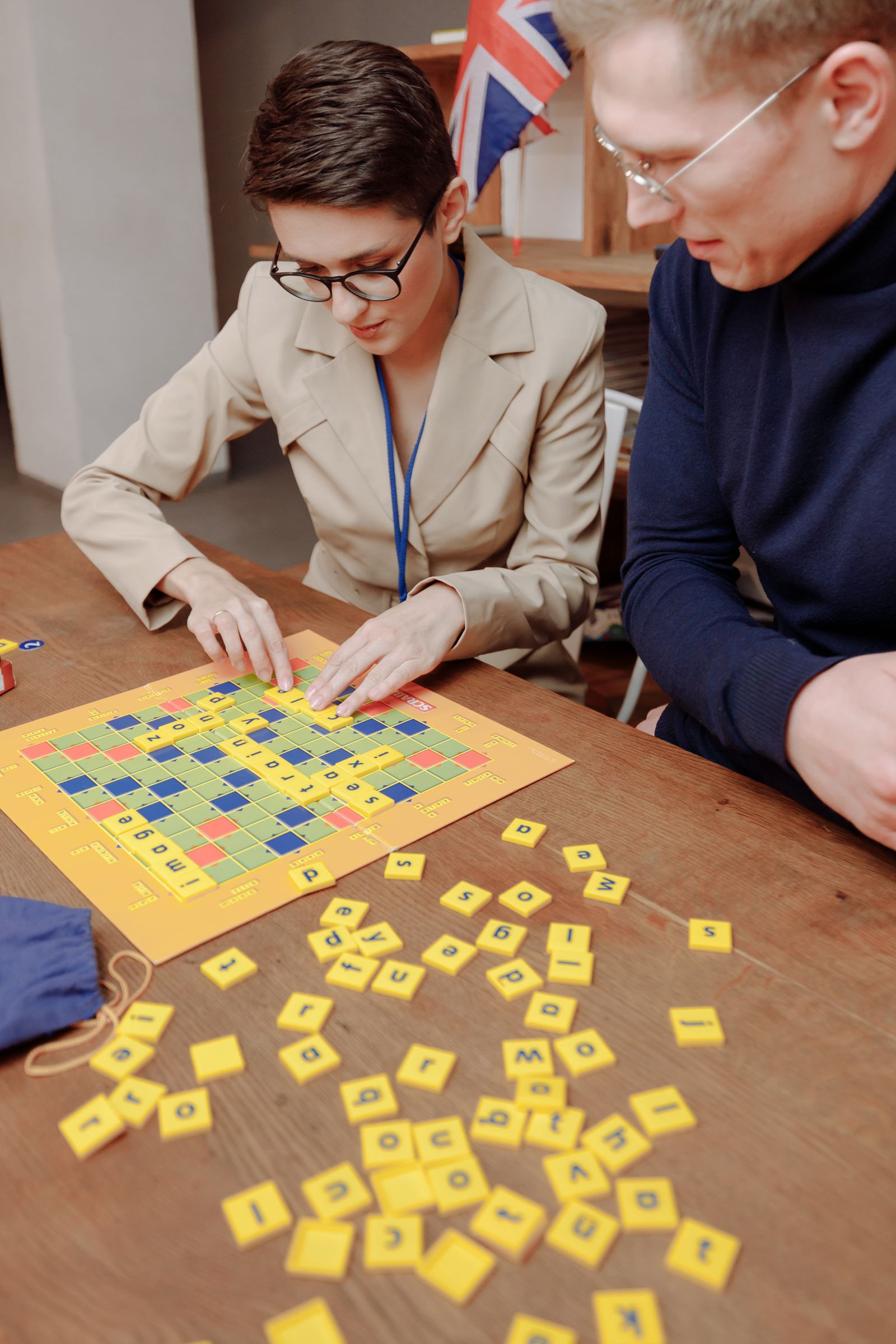Woman playing a word game with letter tiles