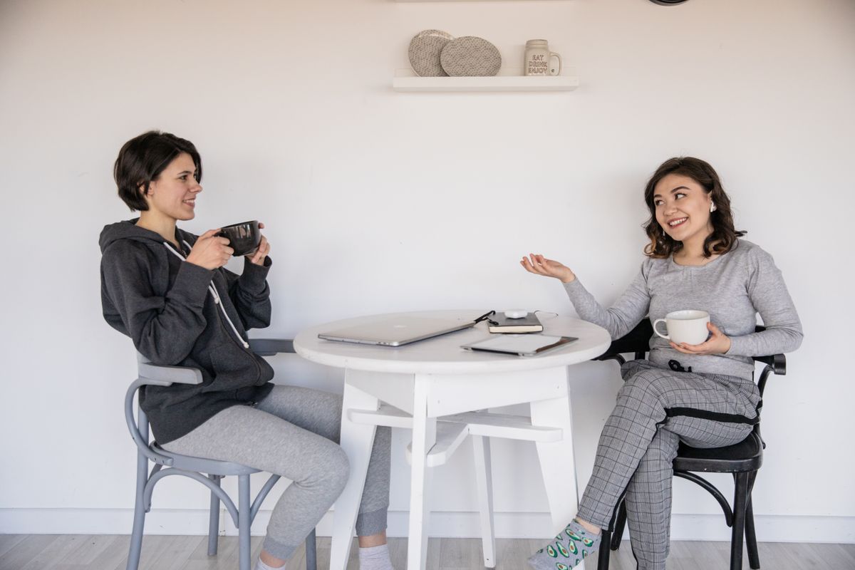 Two women having a conversation at a table